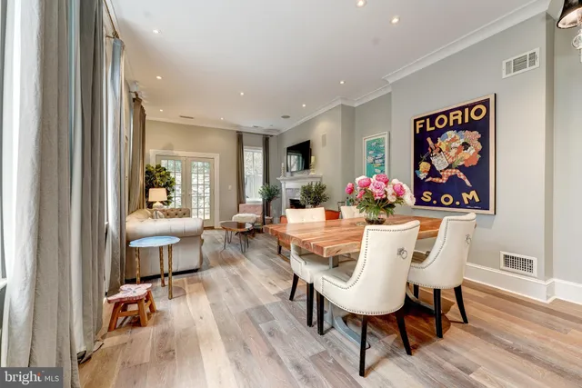 a view of a dining room with furniture wooden floor and a rug