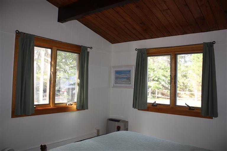30 Fox Island Road, Unit 10D Wellfleet, MA 02667 - Photo 13 of 17 a bedroom with a bed and a window