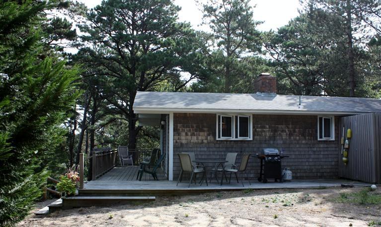 30 Fox Island Road, Unit 10D Wellfleet, MA 02667 - Photo 2 of 17 a front view of a house with garden