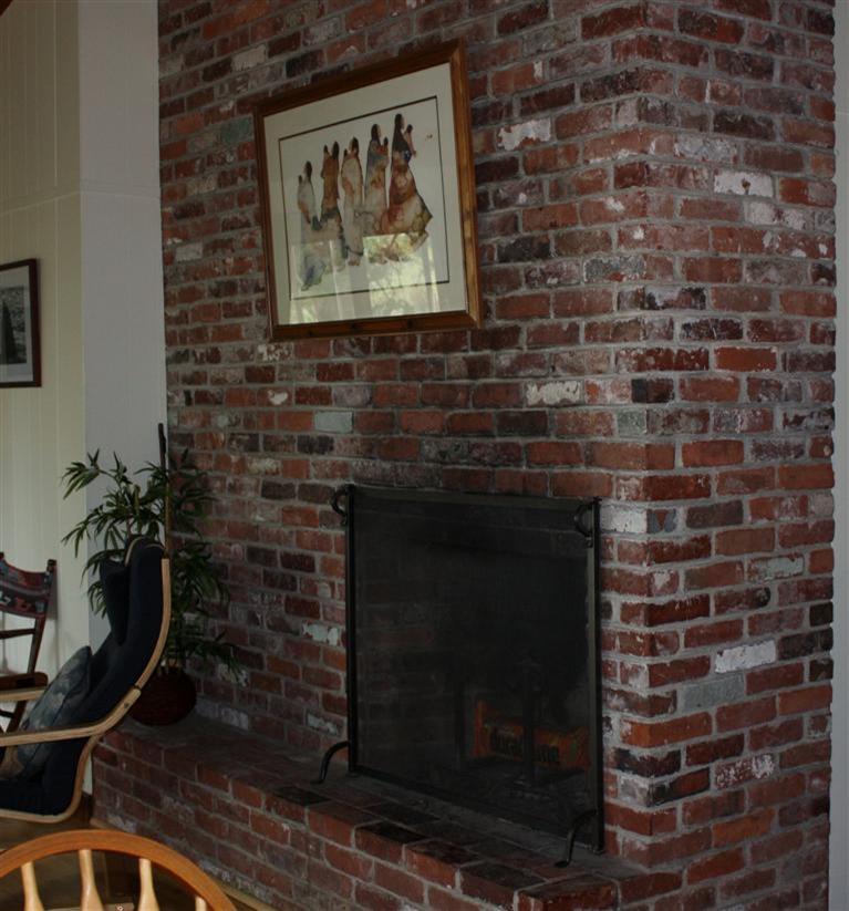 30 Fox Island Road, Unit 10D Wellfleet, MA 02667 - Photo 8 of 17 a living room with a fireplace