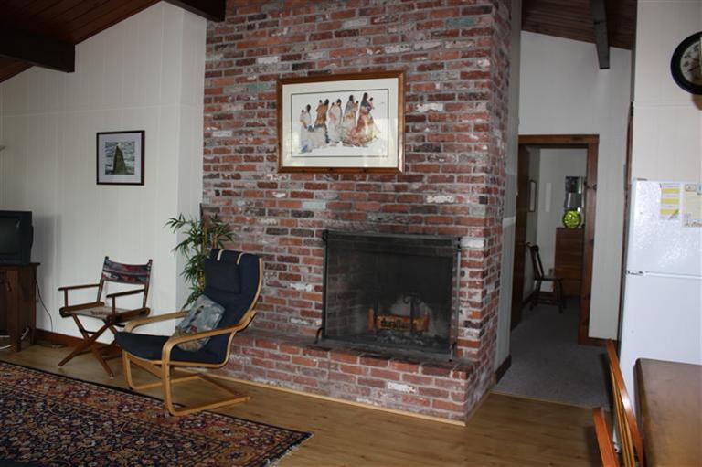 30 Fox Island Road, Unit 10D Wellfleet, MA 02667 - Photo 10 of 17 a living room with furniture and a fireplace