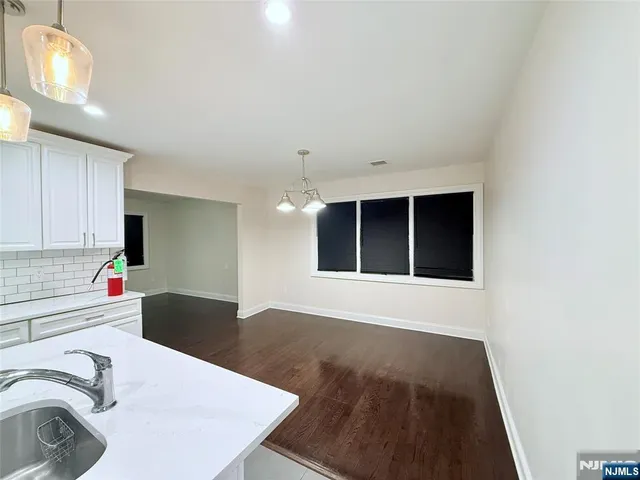 a view of a kitchen with a sink cabinets and a dishwasher