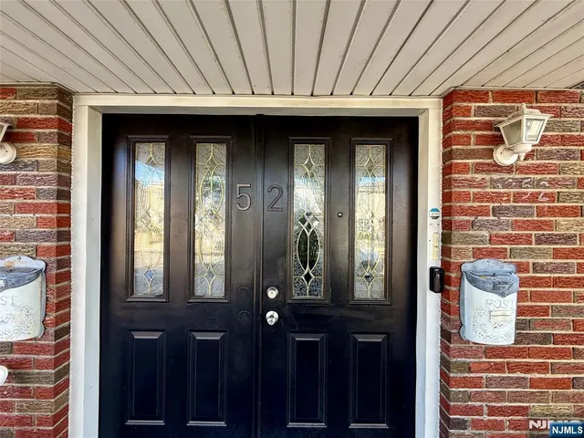a view of a wooden door of the house