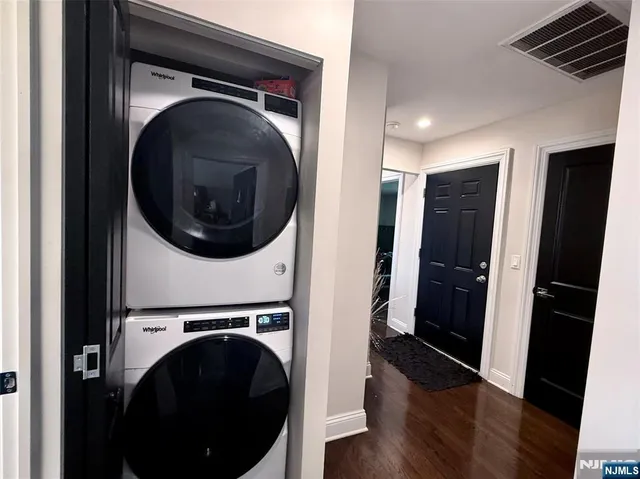 a view of a hallway with washer and dryer