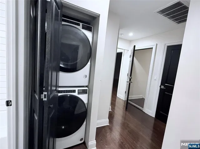 a view of a storage and utility room with washer and dryer