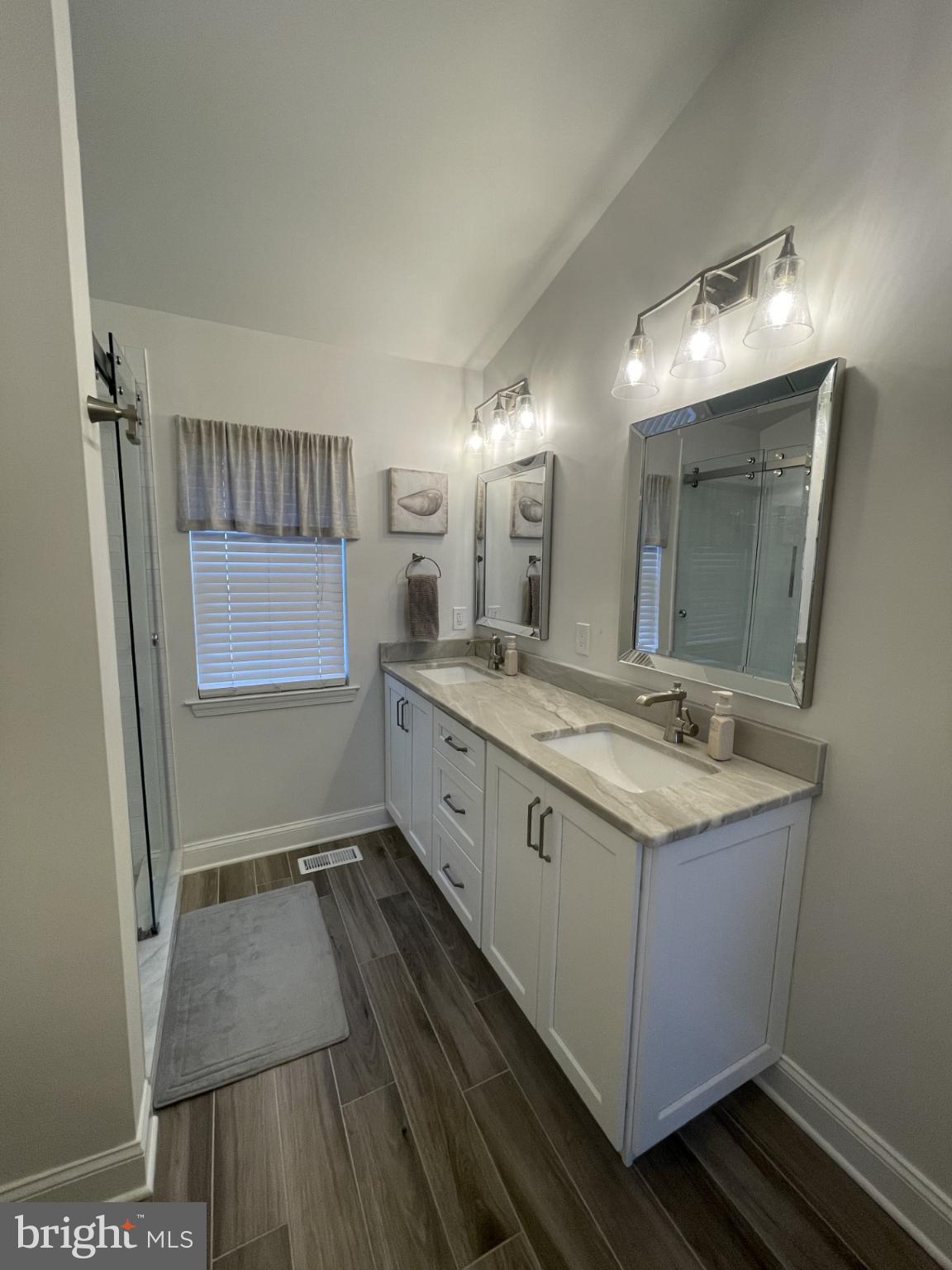 424 Trumbull Court Newtown, PA 18940 - Photo 13 of 21 a spacious bathroom with a double vanity sink and mirror