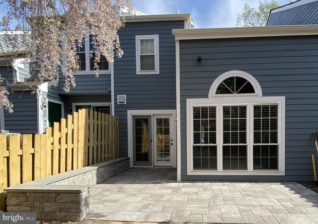 a front view of a house with a large window