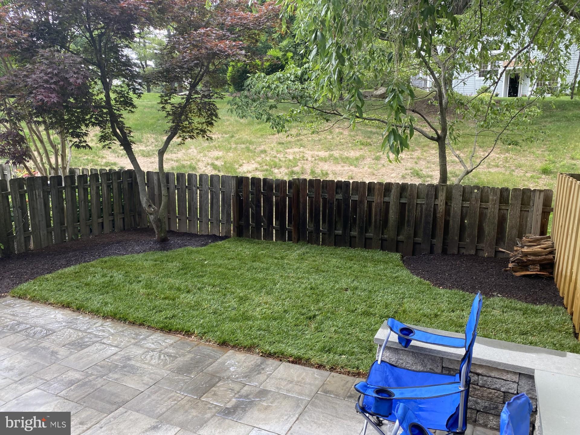 424 Trumbull Court Newtown, PA 18940 - Photo 21 of 21 a view of a backyard with furniture and a fire pit