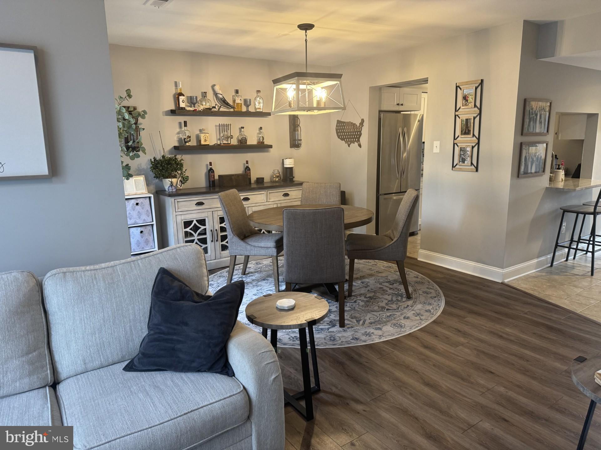424 Trumbull Court Newtown, PA 18940 - Photo 4 of 21 a living room with furniture and a chandelier
