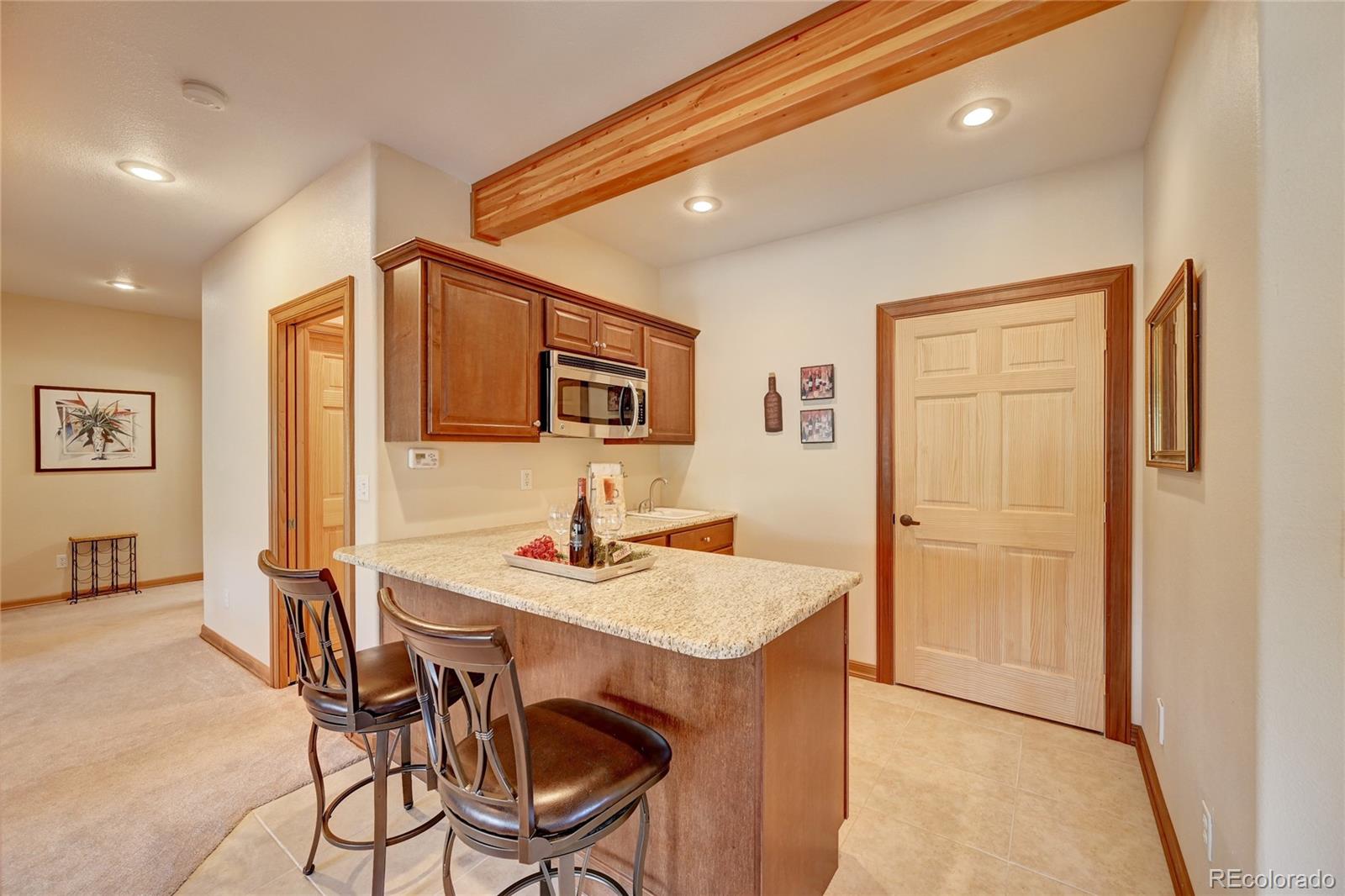 27164 Sun Ridge Drive Evergreen, CO 80439 - Photo 30 of 40 a view of a dining room with furniture