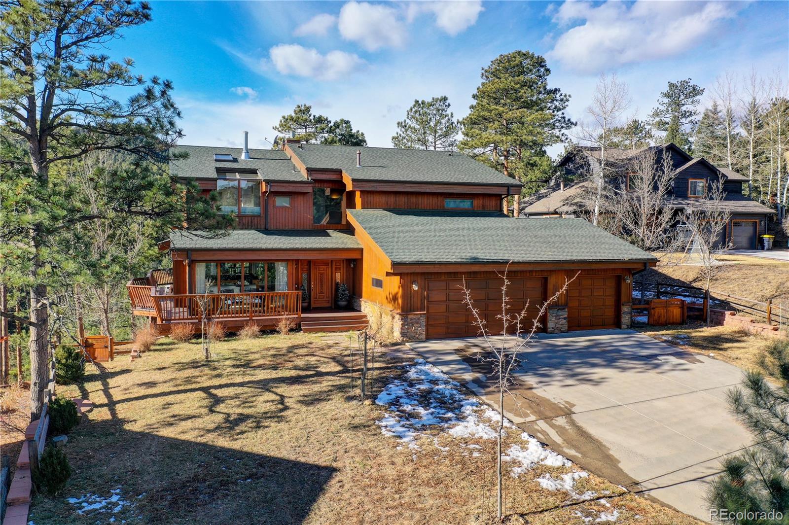 27164 Sun Ridge Drive Evergreen, CO 80439 - Photo 38 of 40 a view of a house with a yard