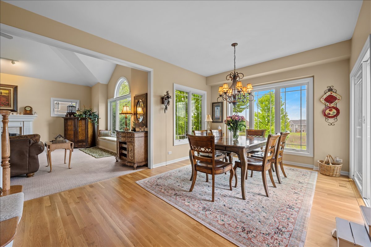 430 Alberosky Way Batavia, IL 60510 - Photo 12 of 49 a dining room with furniture entryway and wooden floor
