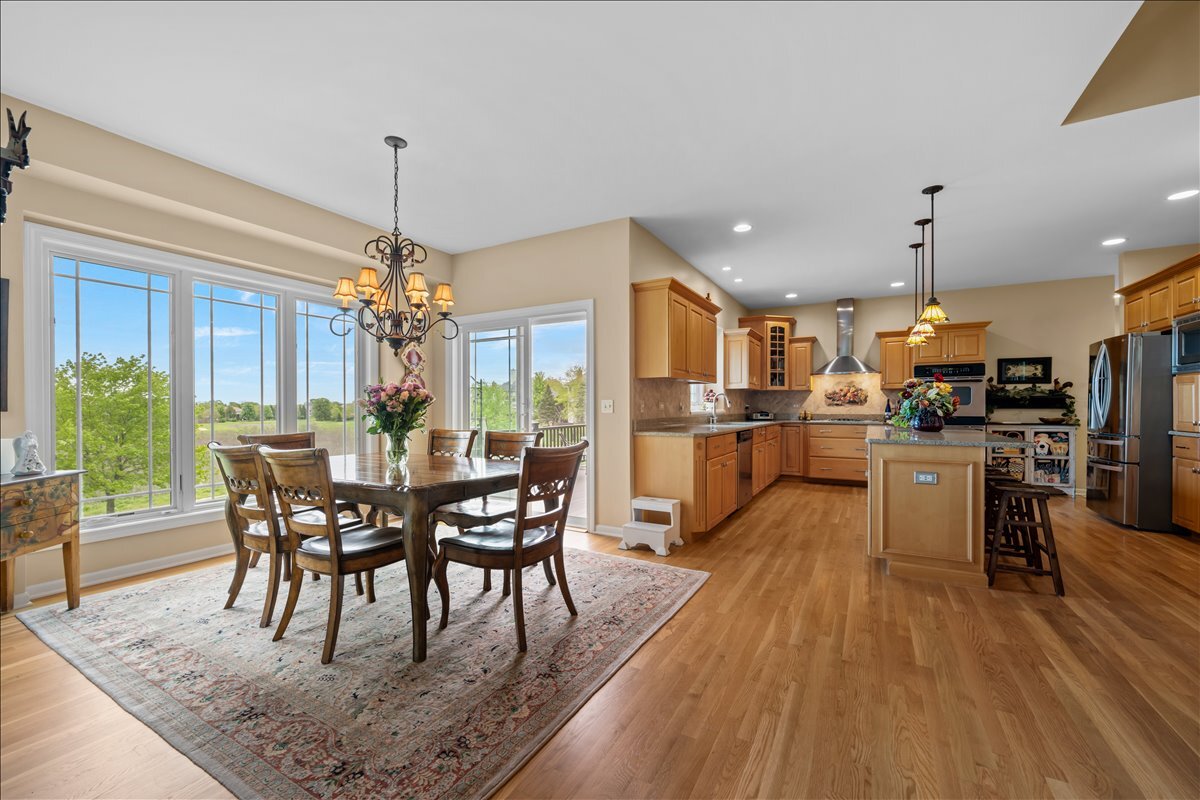 430 Alberosky Way Batavia, IL 60510 - Photo 13 of 49 a view of a dining room with furniture window and wooden floor