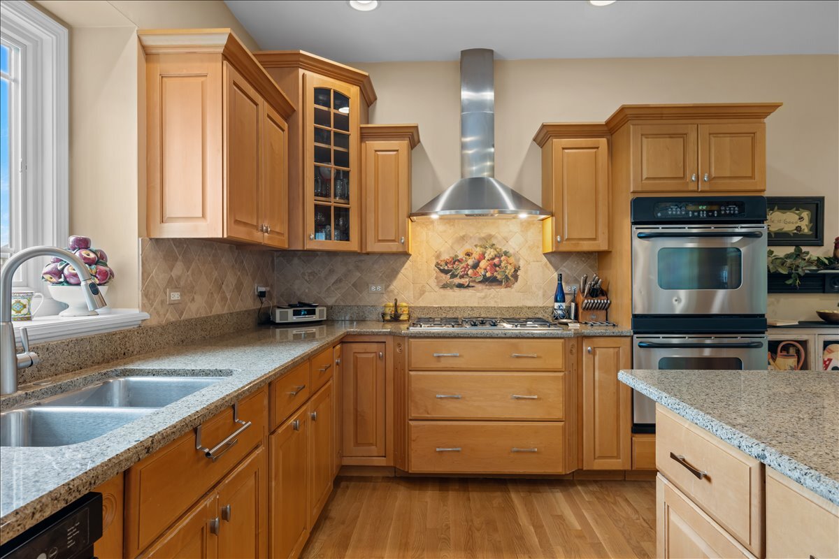 430 Alberosky Way Batavia, IL 60510 - Photo 15 of 49 a kitchen with stainless steel appliances granite countertop a sink stove and cabinets
