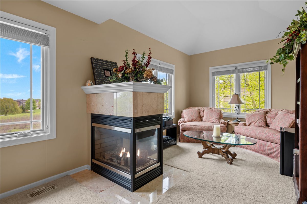430 Alberosky Way Batavia, IL 60510 - Photo 23 of 49 a living room with furniture and a fireplace