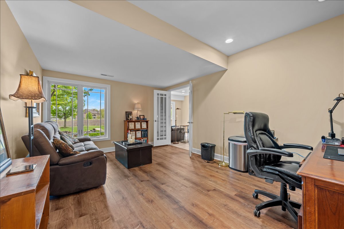 430 Alberosky Way Batavia, IL 60510 - Photo 34 of 49 a living room with furniture flat screen tv and a large window