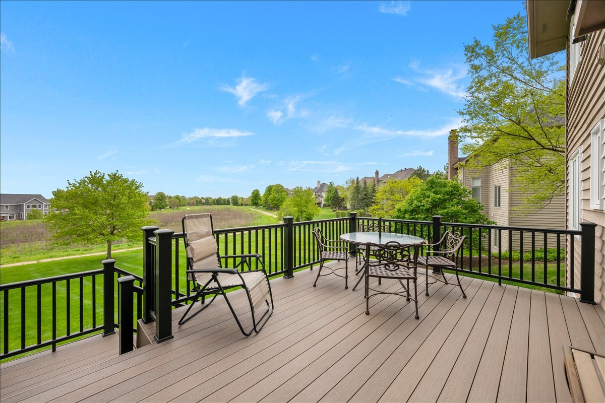 430 Alberosky Way Batavia, IL 60510 - Photo 36 of 49 a view of balcony with furniture and wooden floor