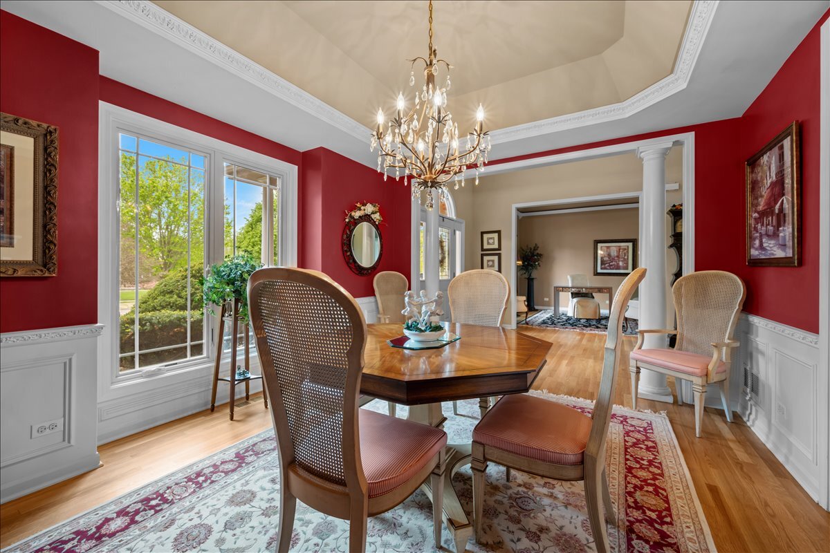 430 Alberosky Way Batavia, IL 60510 - Photo 8 of 49 a dining room with furniture a rug and wooden floor