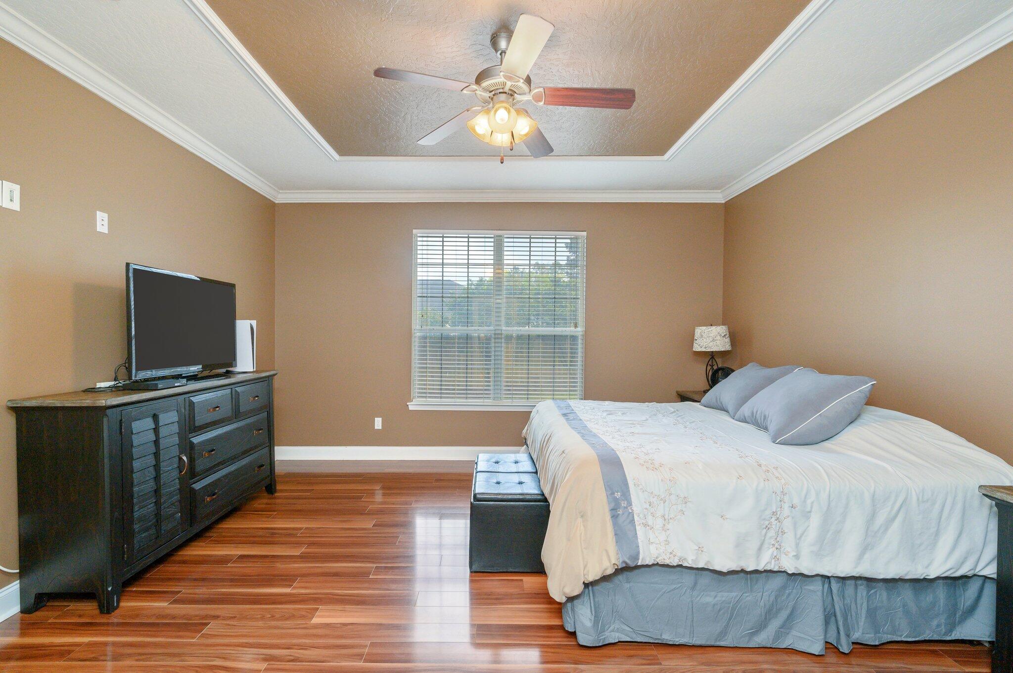 203 Eleases Crossing Crestview, FL 32539 - Photo 17 of 43 a bedroom with a bed and a flat screen tv