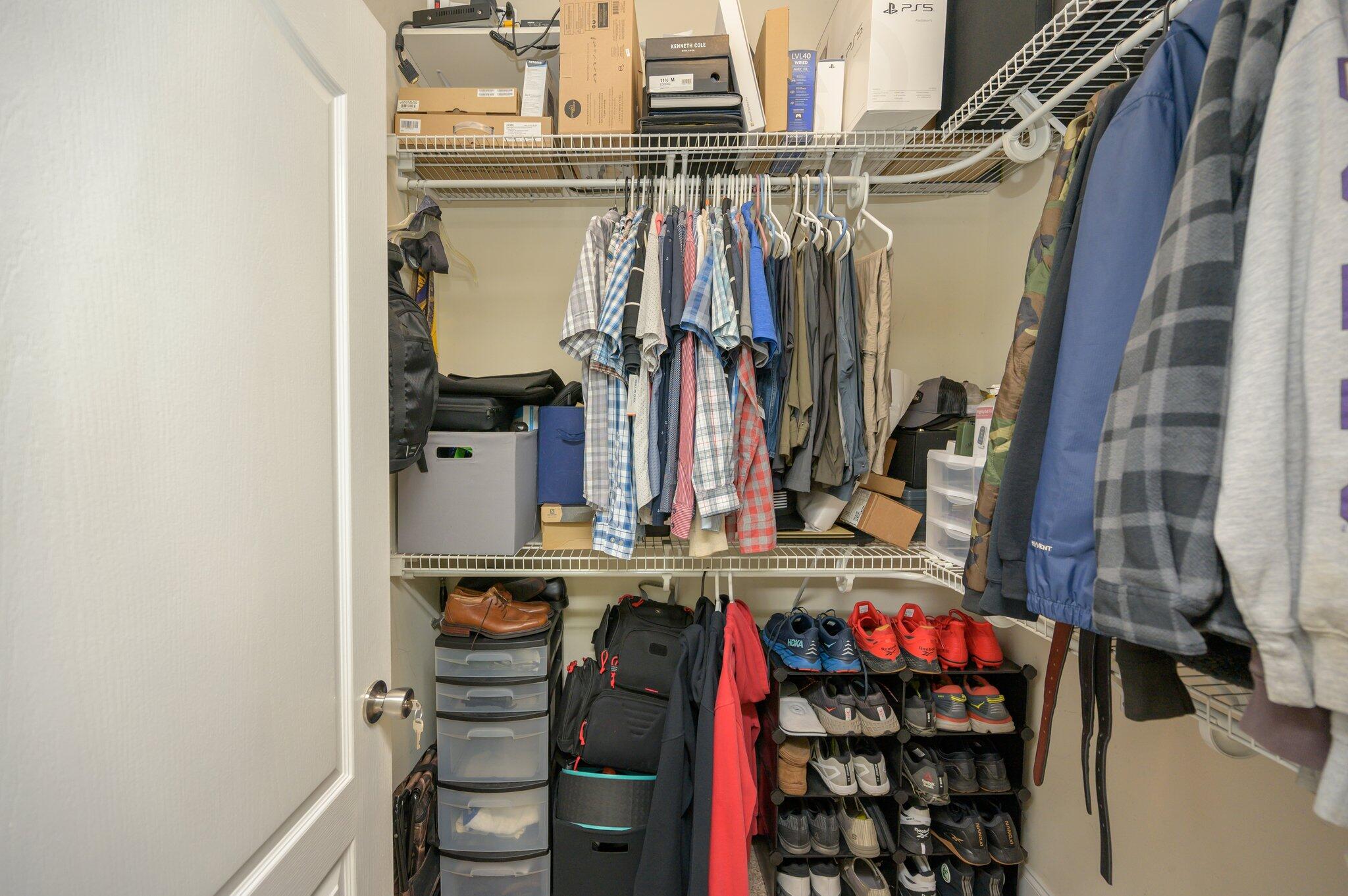 203 Eleases Crossing Crestview, FL 32539 - Photo 24 of 43 a view of walk in closet with clothes and shoes