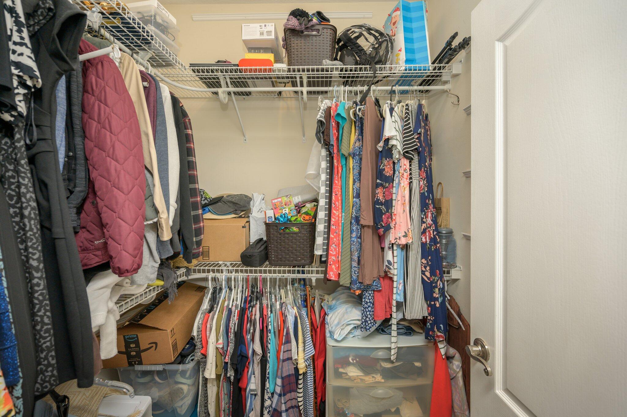 203 Eleases Crossing Crestview, FL 32539 - Photo 25 of 43 a view of walk in closet with clothes