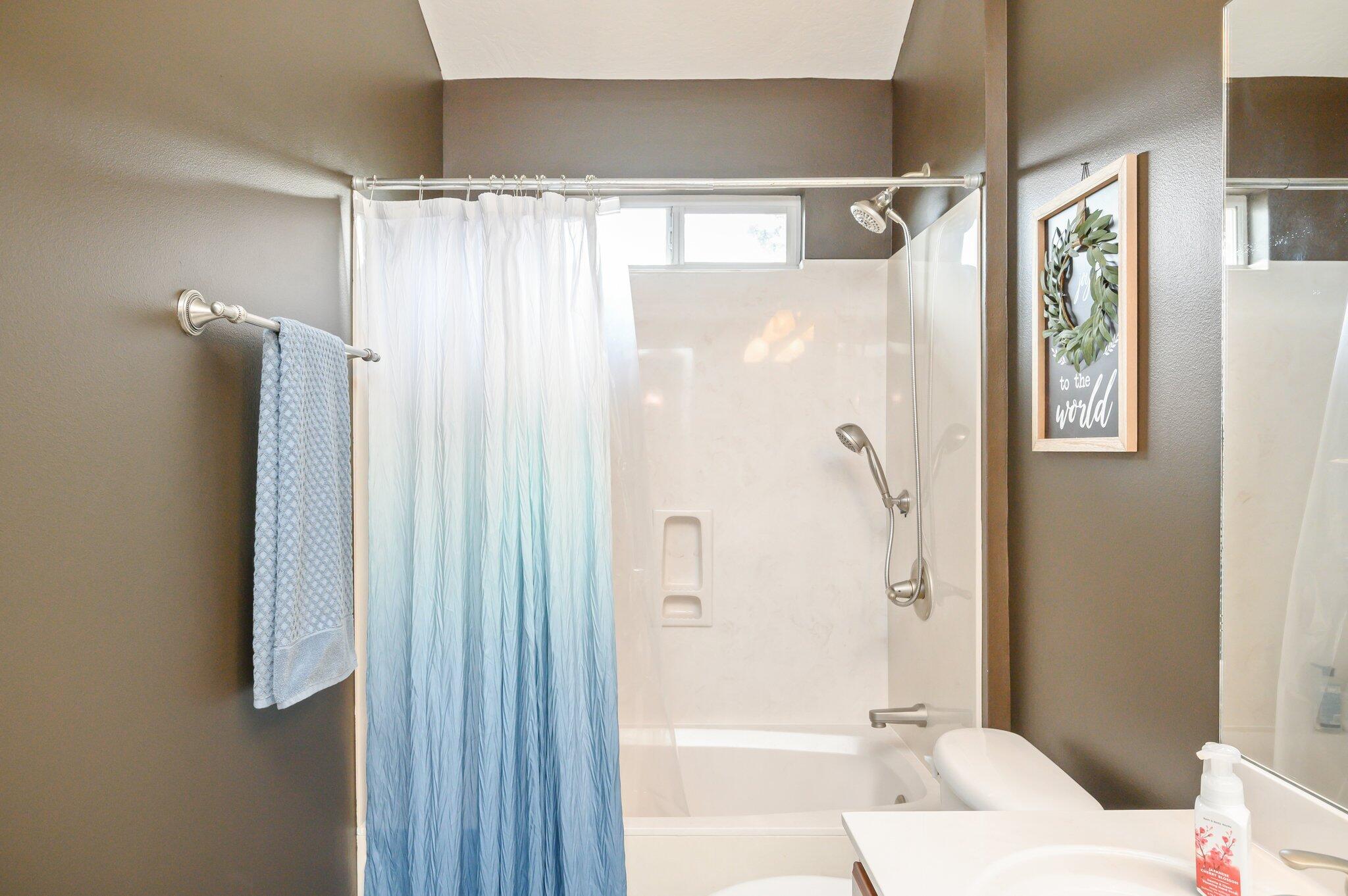 203 Eleases Crossing Crestview, FL 32539 - Photo 30 of 43 a bathroom with a shower curtain and a window