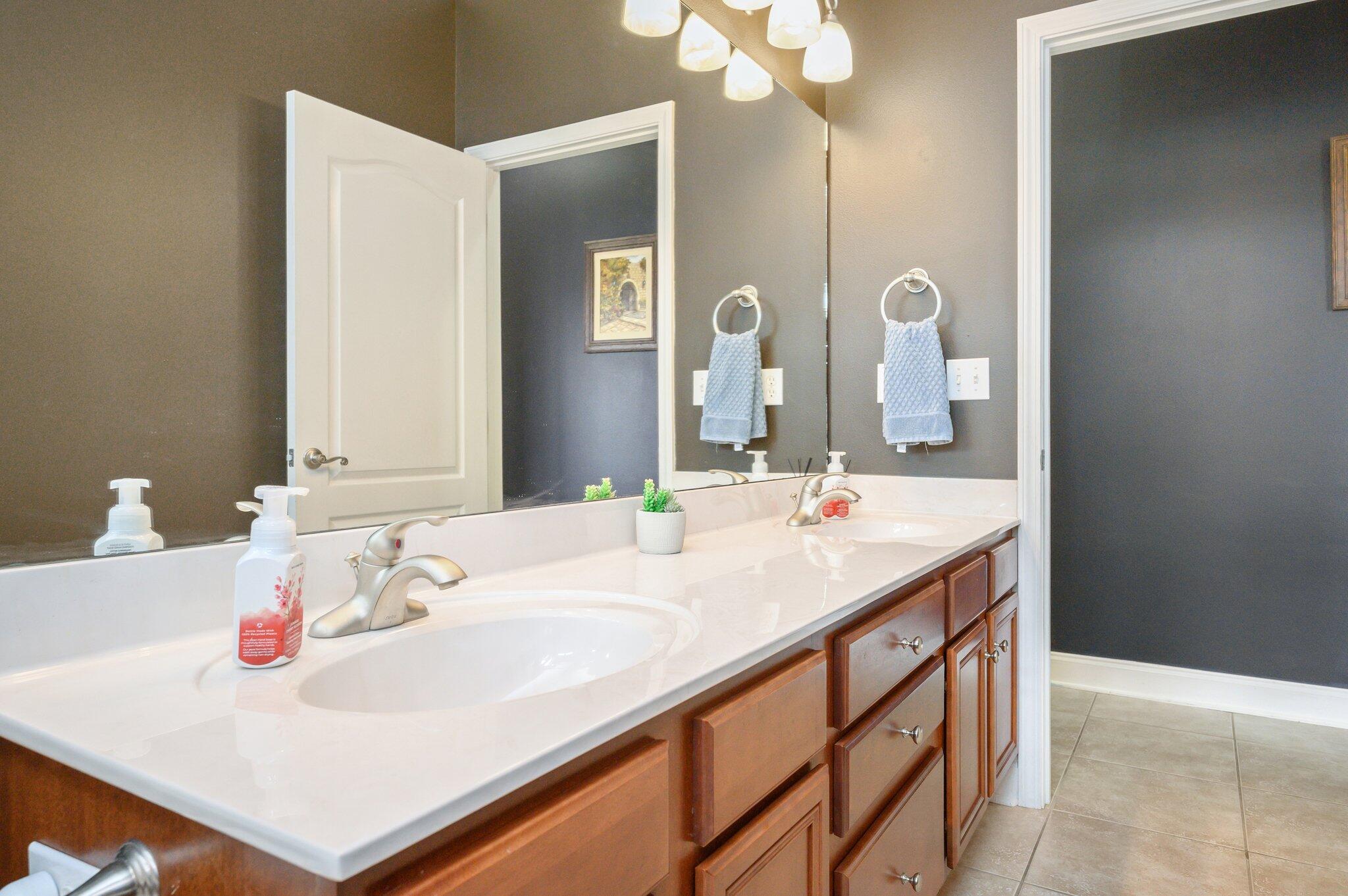 203 Eleases Crossing Crestview, FL 32539 - Photo 32 of 43 a bathroom with a sink and a mirror