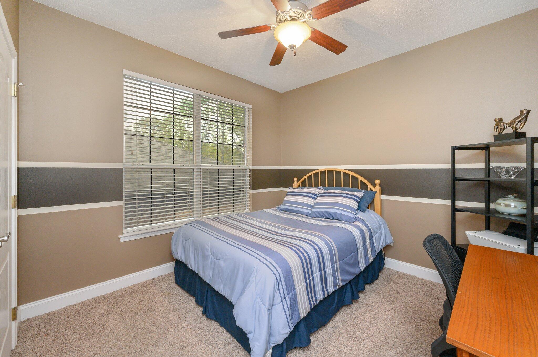 203 Eleases Crossing Crestview, FL 32539 - Photo 33 of 43 a bedroom with a bed and window