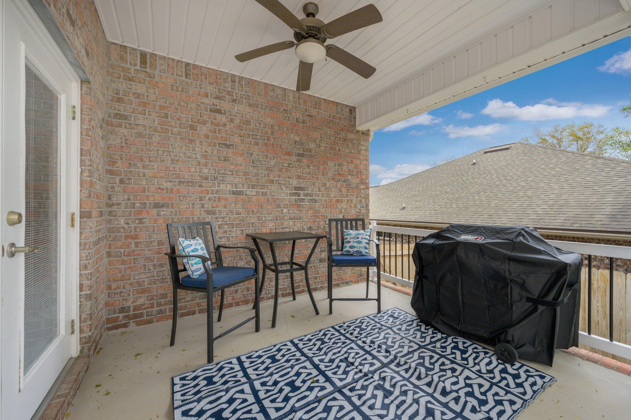 203 Eleases Crossing Crestview, FL 32539 - Photo 36 of 43 a living room with furniture a rug and a chandelier