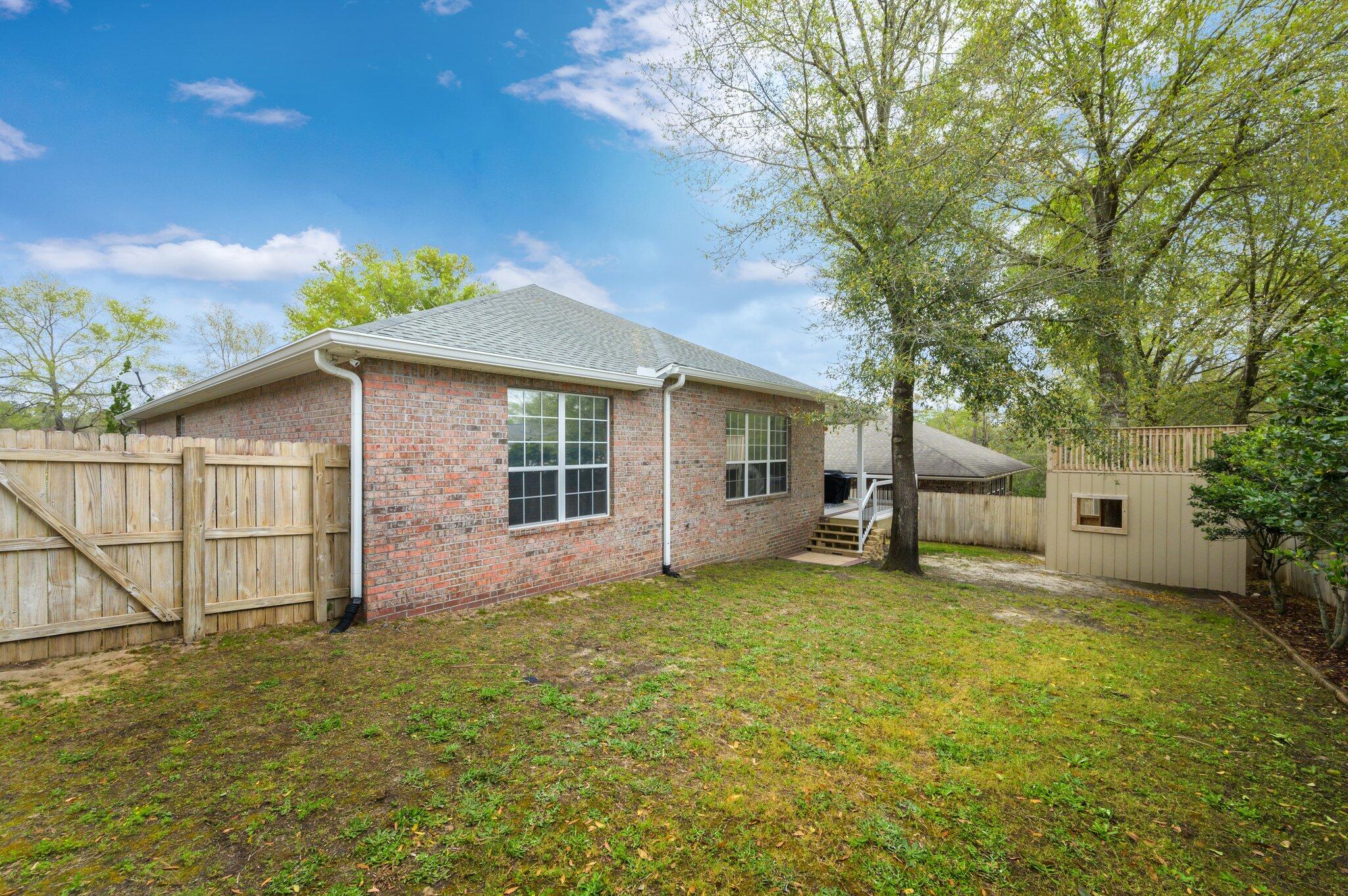203 Eleases Crossing Crestview, FL 32539 - Photo 38 of 43 a view of a house with a yard