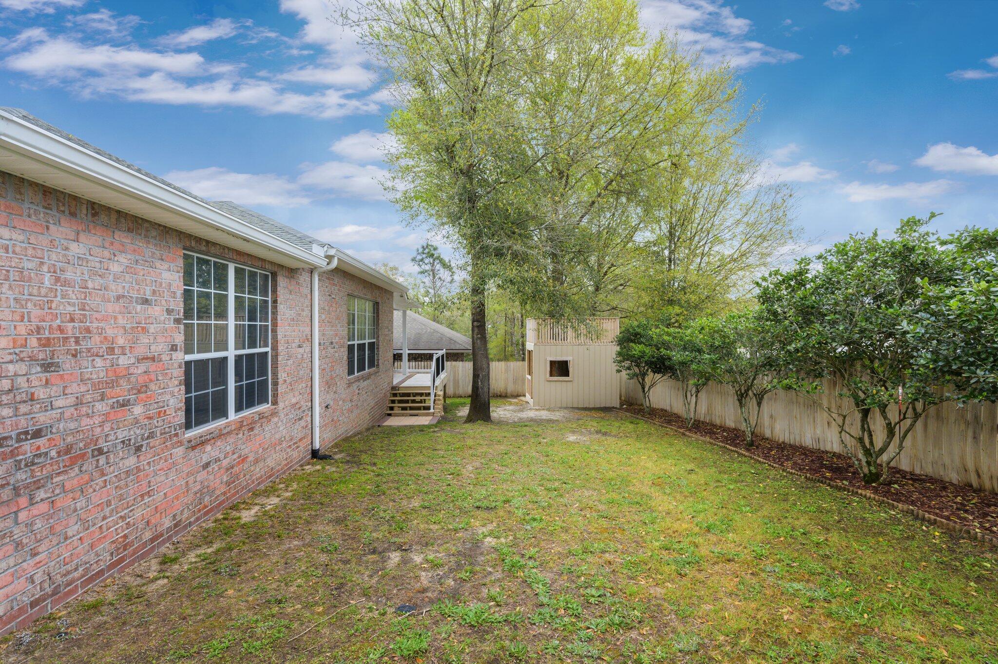 203 Eleases Crossing Crestview, FL 32539 - Photo 39 of 43 a view of a house with a yard and tree