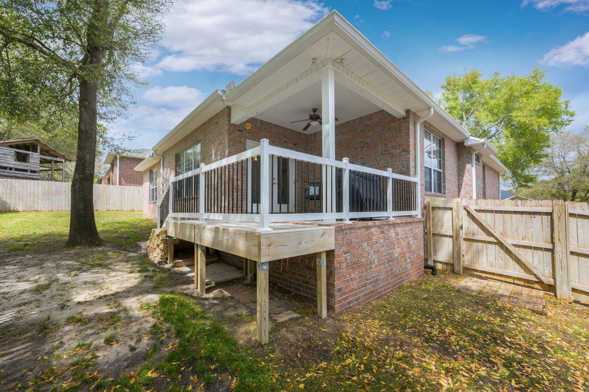 203 Eleases Crossing Crestview, FL 32539 - Photo 42 of 43 a house view with a garden space
