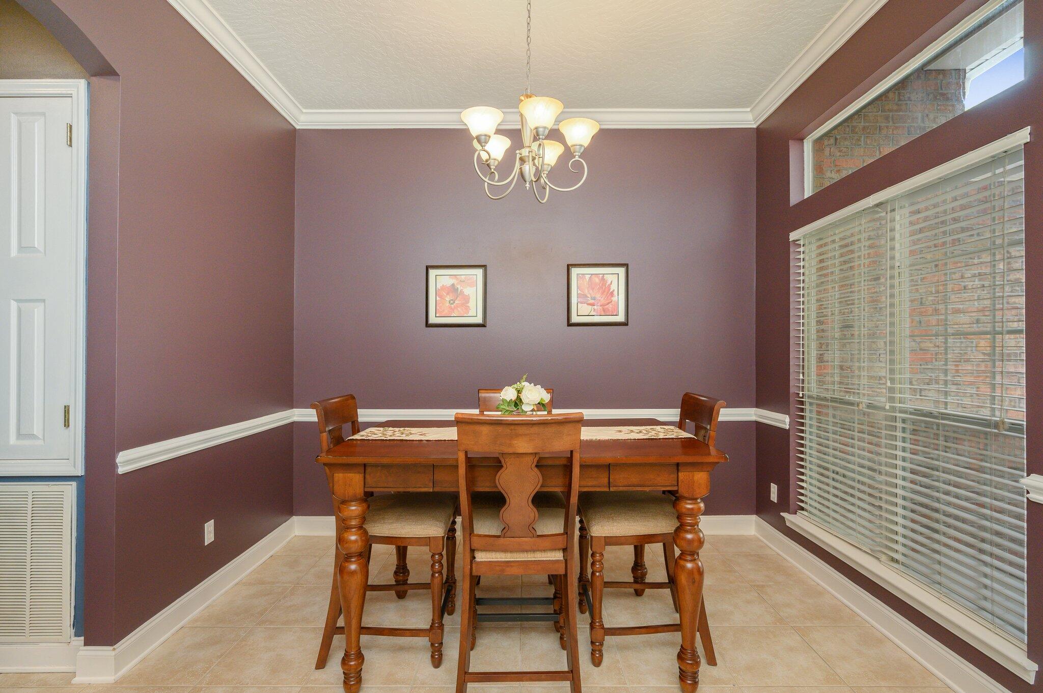 203 Eleases Crossing Crestview, FL 32539 - Photo 5 of 43 a view of a dining room with furniture and chandelier