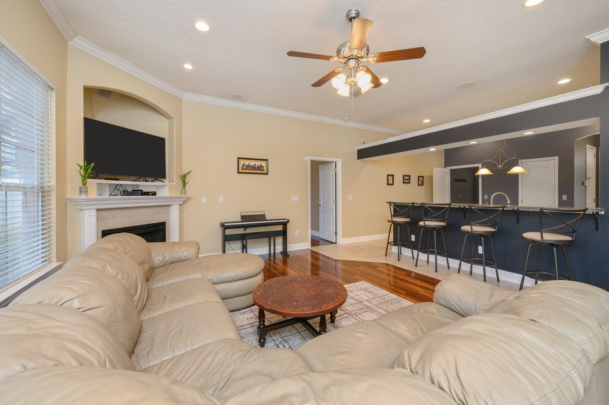 203 Eleases Crossing Crestview, FL 32539 - Photo 8 of 43 a living room with furniture a flat screen tv and kitchen view