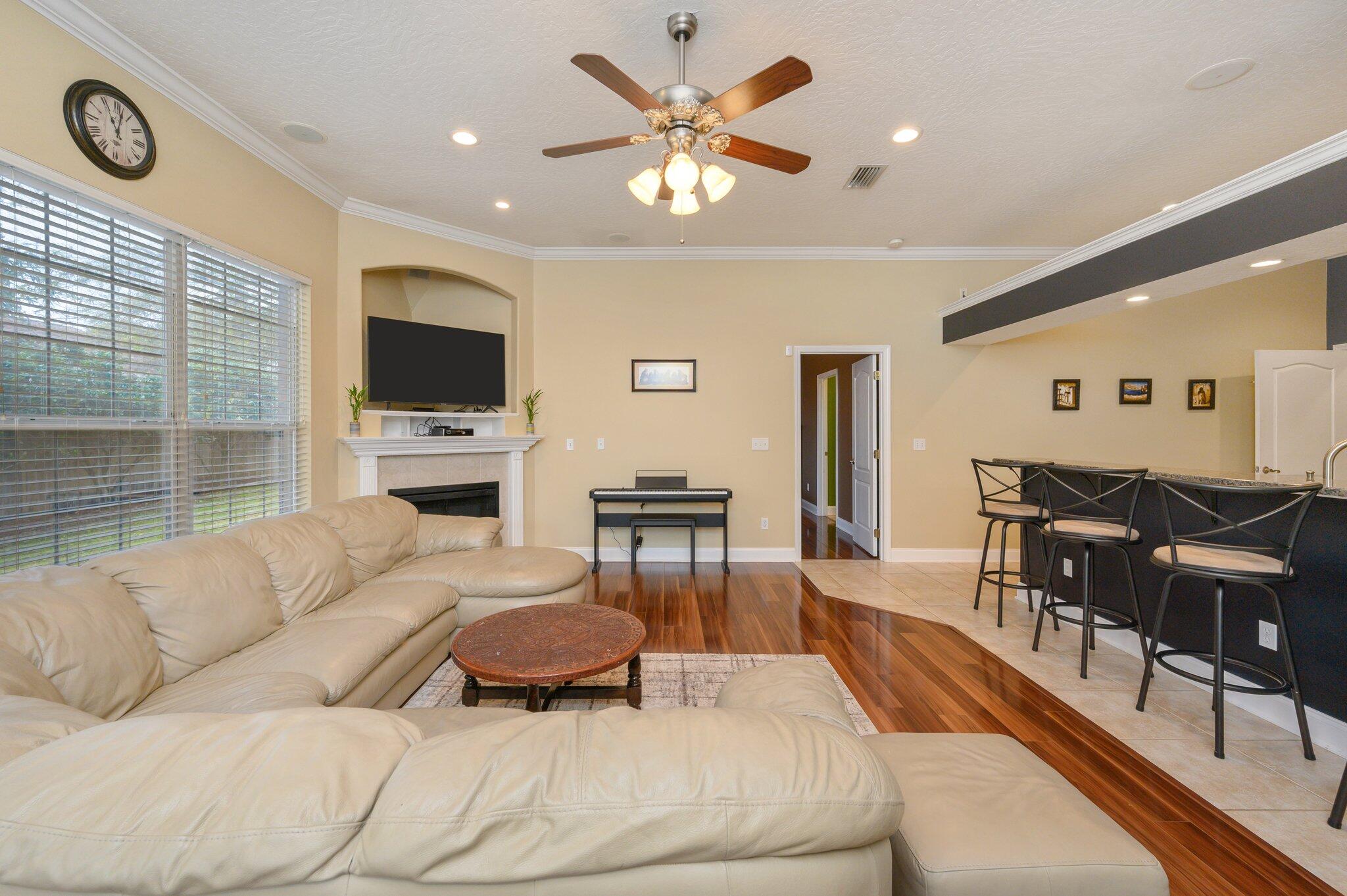 203 Eleases Crossing Crestview, FL 32539 - Photo 9 of 43 a living room with furniture and a flat screen tv