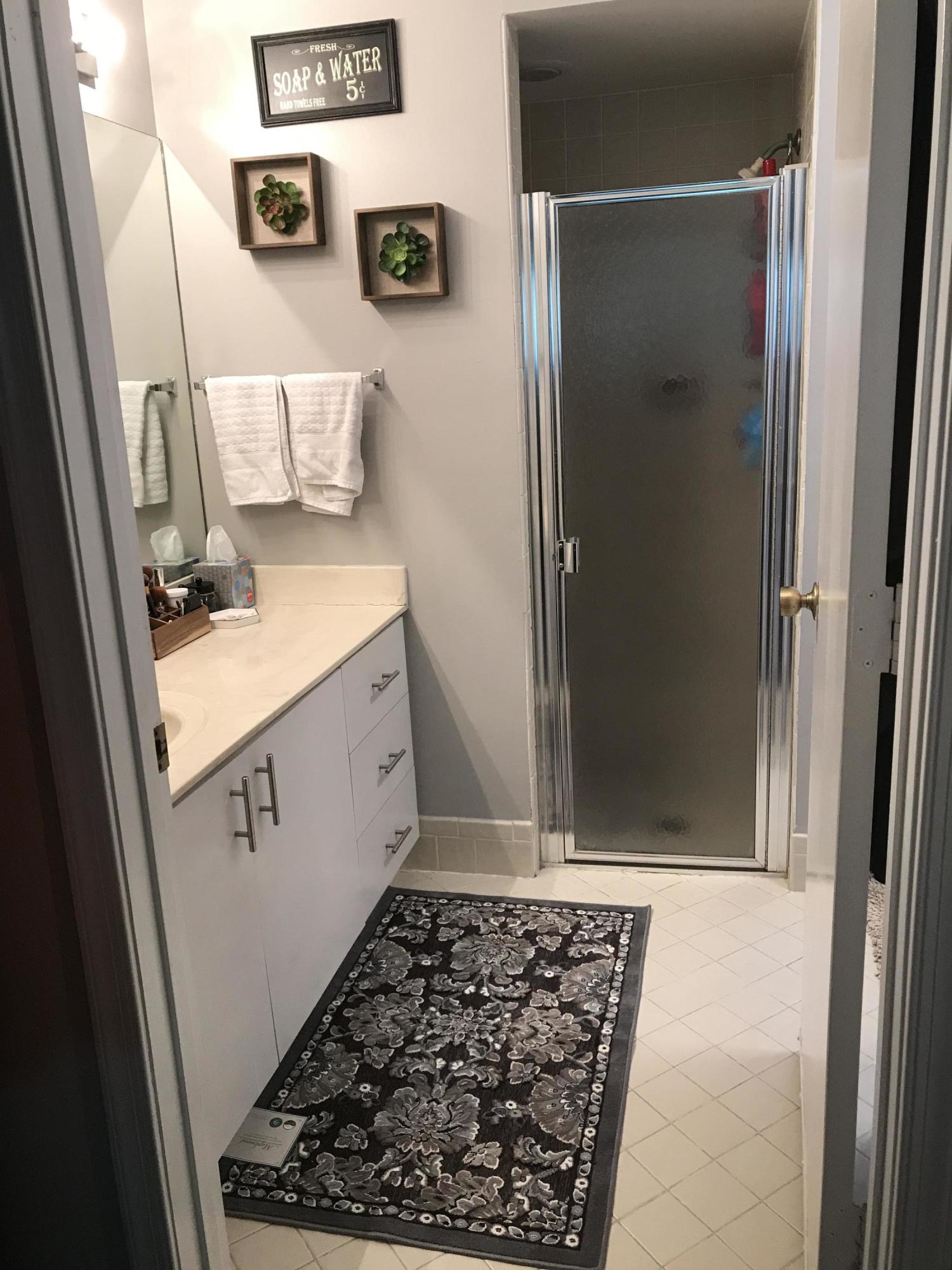 20836 Boca Ridge Drive North Boca Raton, FL 33428 - Photo 12 of 12 a bathroom with a sink a toilet and shower