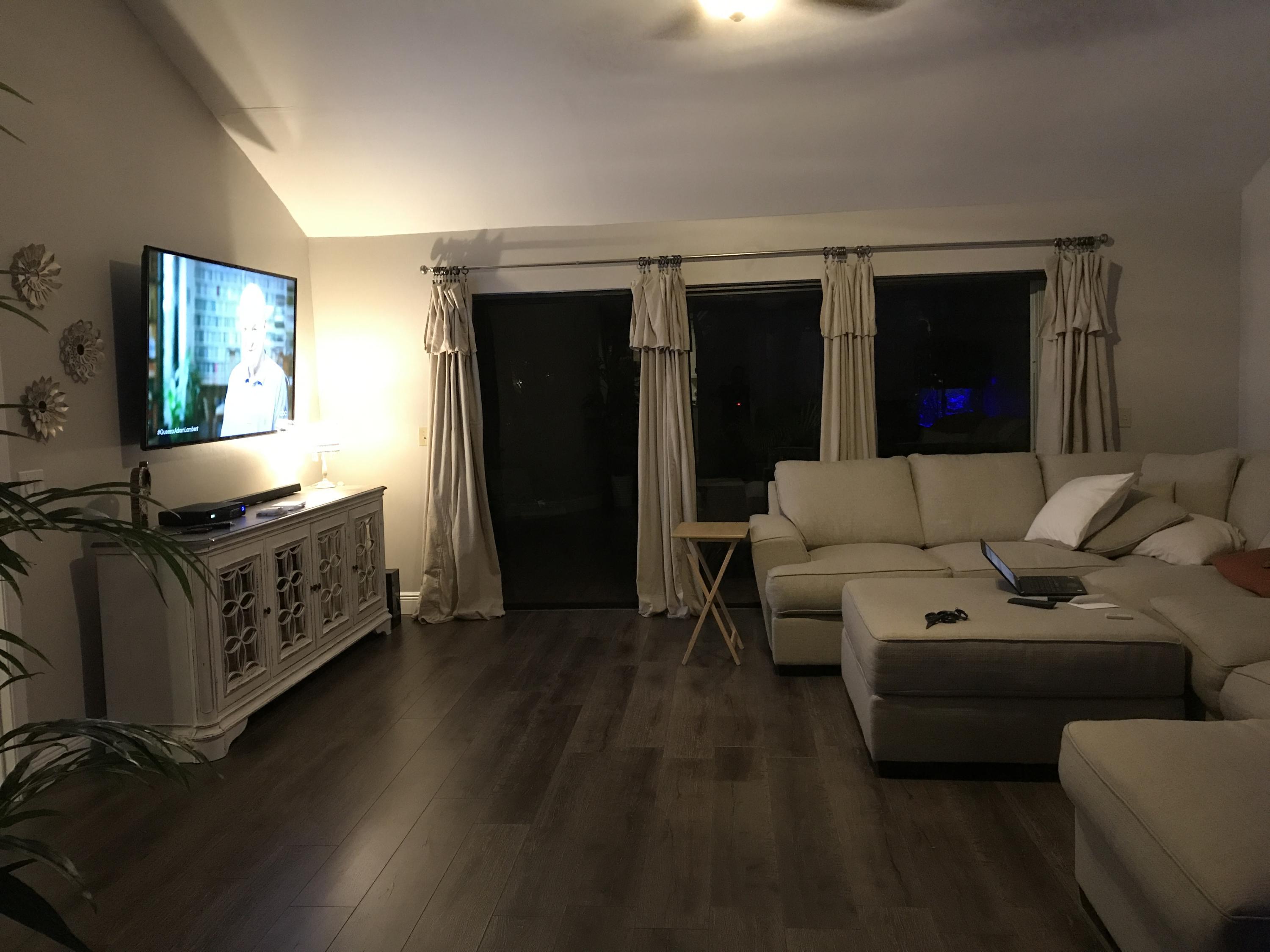 20836 Boca Ridge Drive North Boca Raton, FL 33428 - Photo 8 of 12 a living room with furniture and a flat screen tv