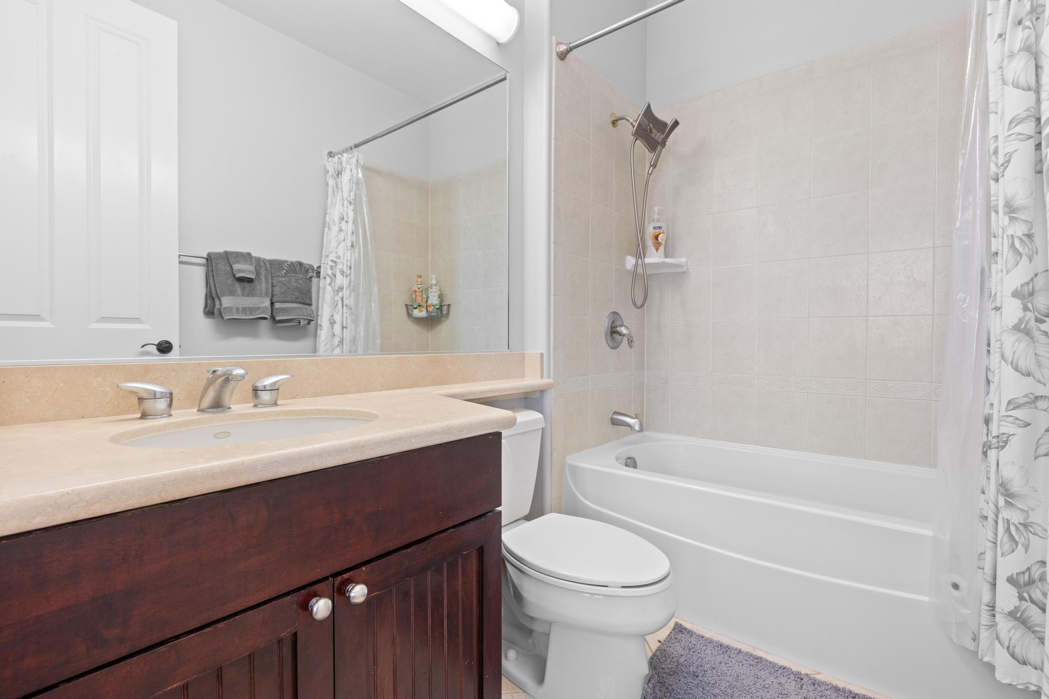 69-200 Pohakulana Place, Unit C4 Waikoloa, HI 96738 - Photo 11 of 30 a bathroom with a sink a toilet and shower