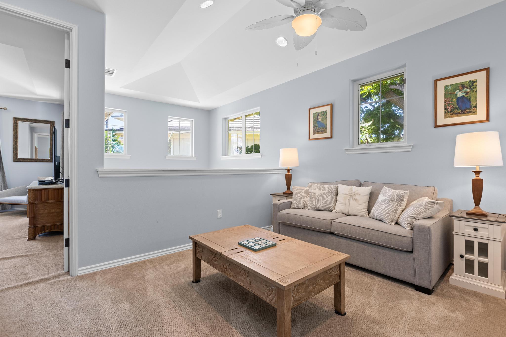 69-200 Pohakulana Place, Unit C4 Waikoloa, HI 96738 - Photo 12 of 30 a living room with furniture a lamp and a window