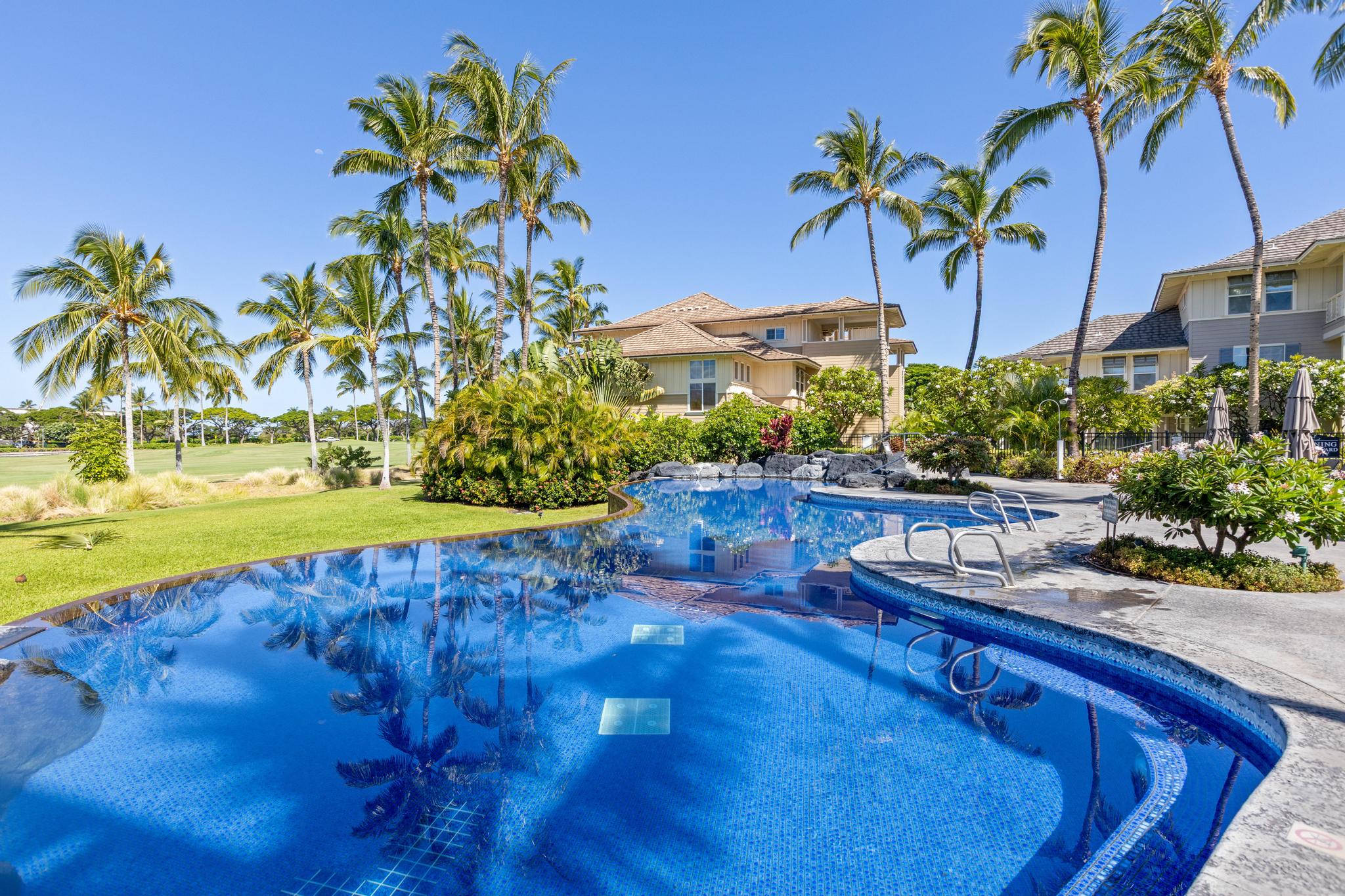 69-200 Pohakulana Place, Unit C4 Waikoloa, HI 96738 - Photo 24 of 30 a view of a swimming pool with a table and chairs