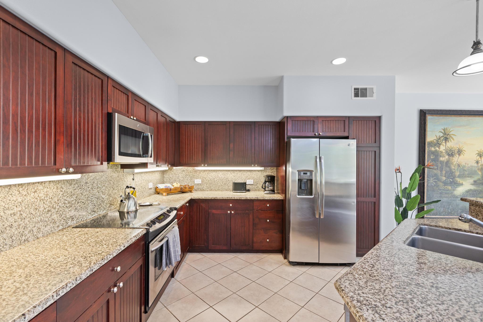 69-200 Pohakulana Place, Unit C4 Waikoloa, HI 96738 - Photo 7 of 30 a kitchen with stainless steel appliances granite countertop a refrigerator stove and sink
