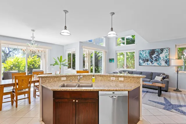 a view of a center island and living room