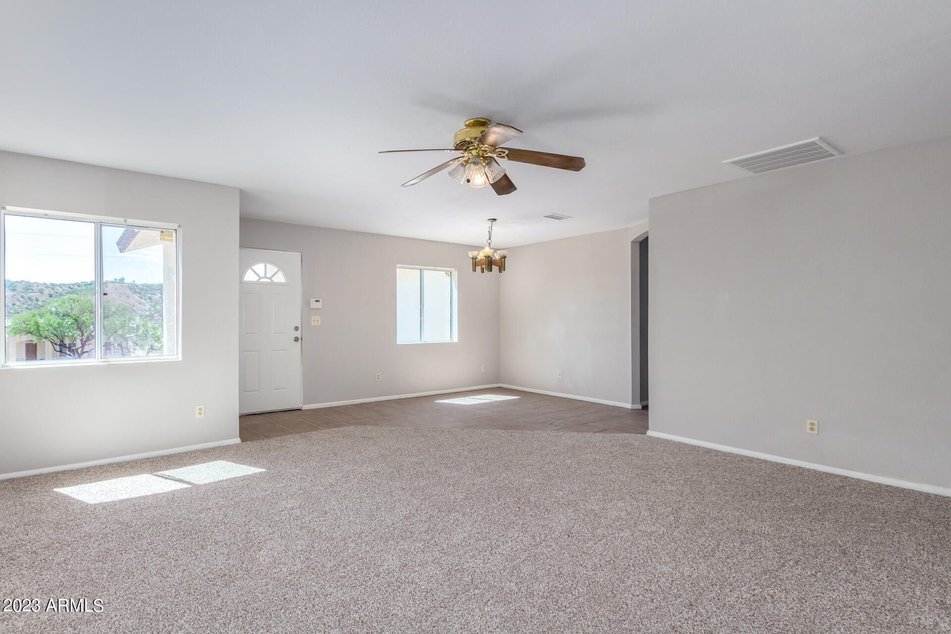 584 Ruben Court Rio Rico, AZ 85648 - Photo 2 of 12 a view of an empty room with a window