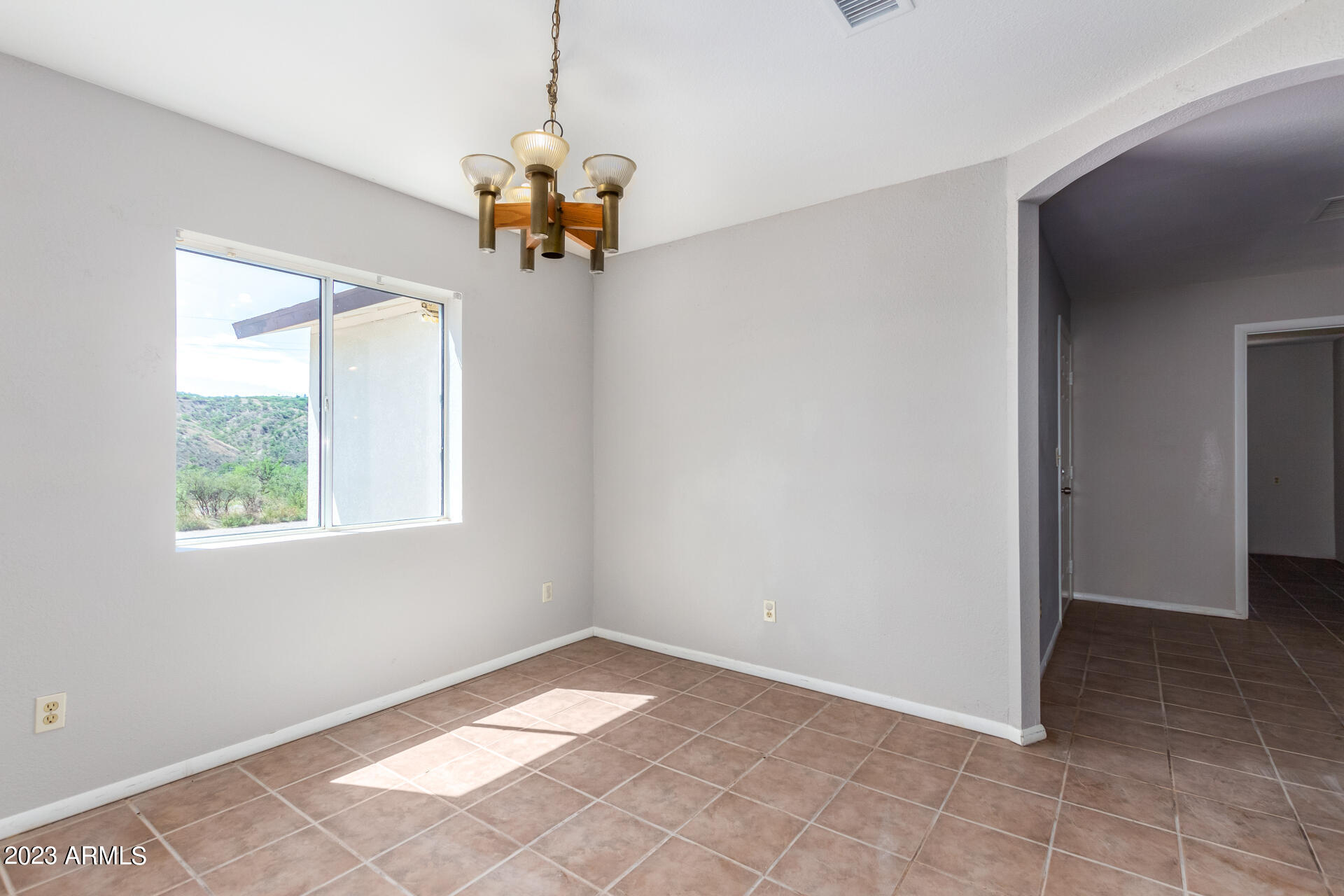 584 Ruben Court Rio Rico, AZ 85648 - Photo 3 of 12 an empty room with a window