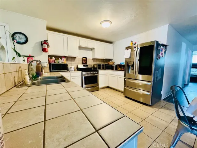 a living room with furniture fireplace and rug