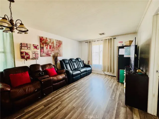 a bedroom with a bed and flat screen tv