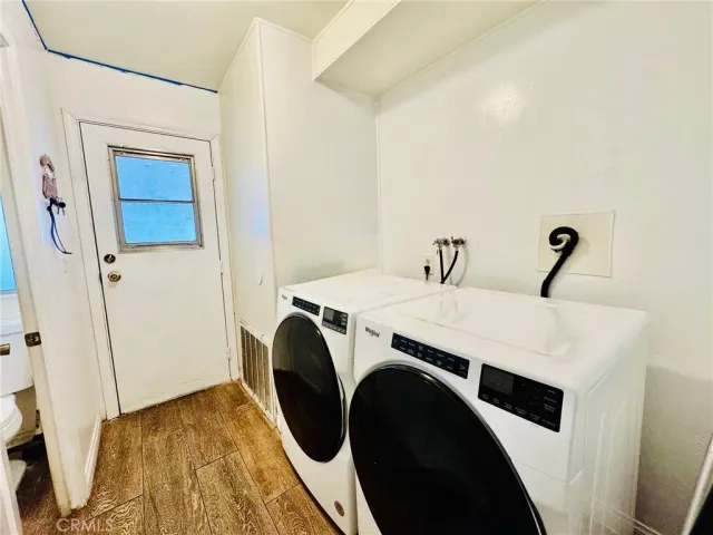 a bedroom with two beds and book shelf