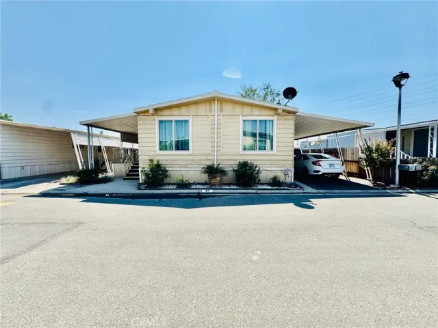 a view of a car park in front of house