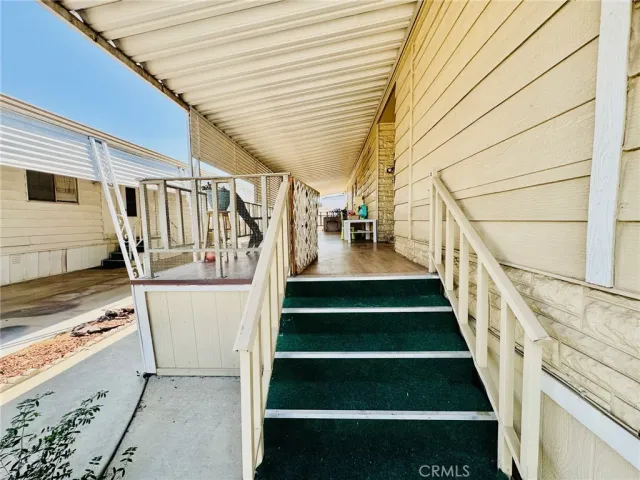 a dining room with chairs and chandelier