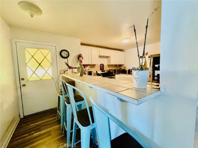 a view of living room with furniture and a flat screen tv